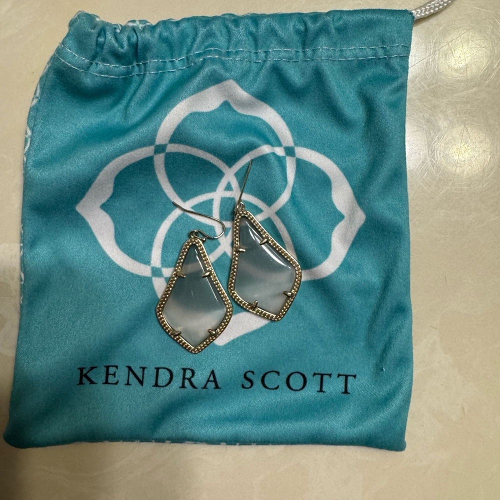 Kendra Scott earrings gold with translucent gray stone